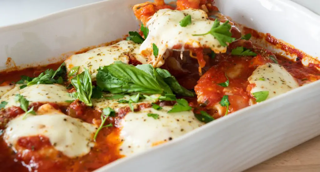 Serving of Mediterranean Chicken Breast with Marinara Sauce and Mozzarella Cheese