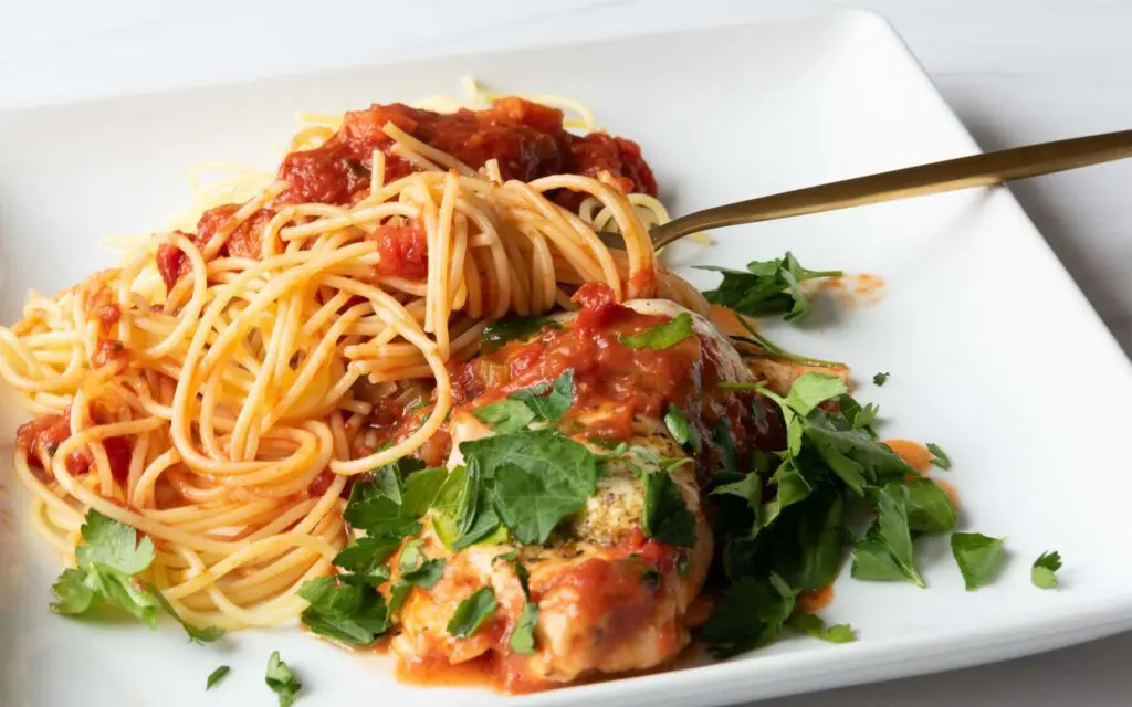 Plate of Pasta with a serving of the Mediterranean Chicken Breasts