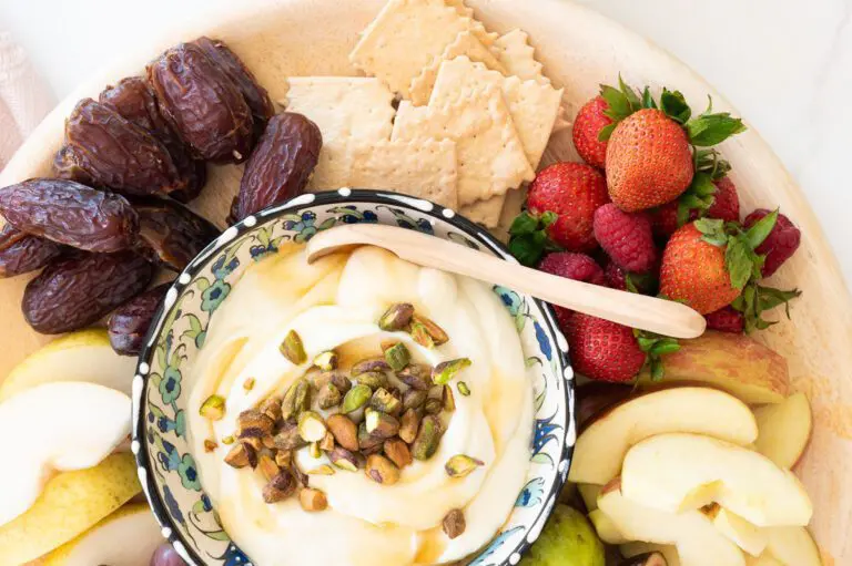 Creamy whipped ricotta with honey and chopped pistachios surrounded by dates, figs and fresh fruit!