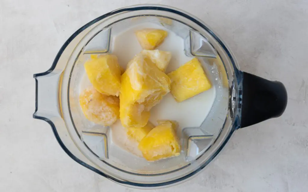 Coconut Milk, Pineapple Juice and Frozen Pineapple in a Blender