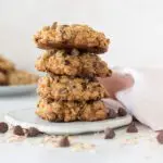 Stack of Gluten Free Oatmeal Chocolate Chip Cookies with a pink napkin