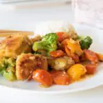 Gluten Free Chicken Stir Fry on Plate with chopsticks.