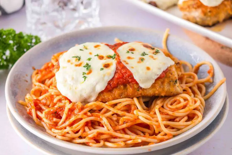 Plate of gluten free chicken parmesan and spaghetti