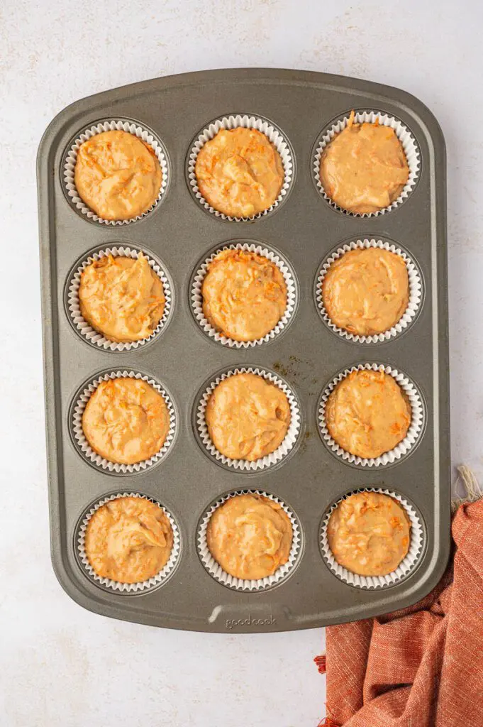 Pour gluten-free cupcake batter in muffin tins