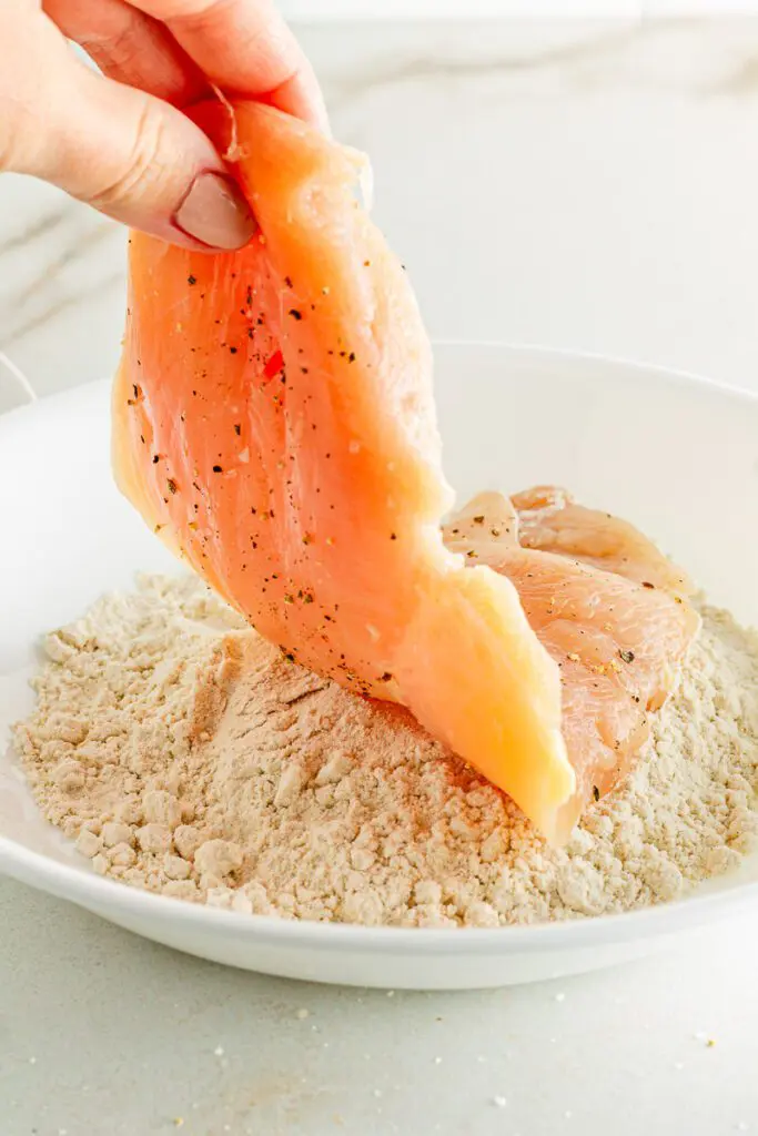 Butterflied chicken dredged in flour