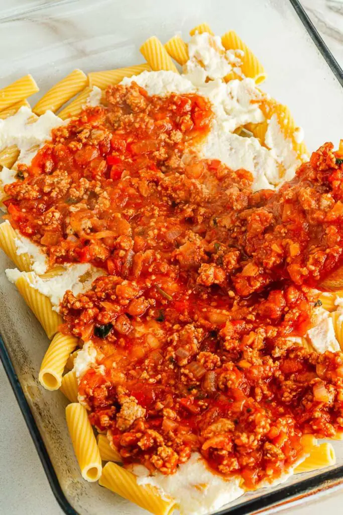 Spread meat sauce evenly over cooked pasta and ricotta