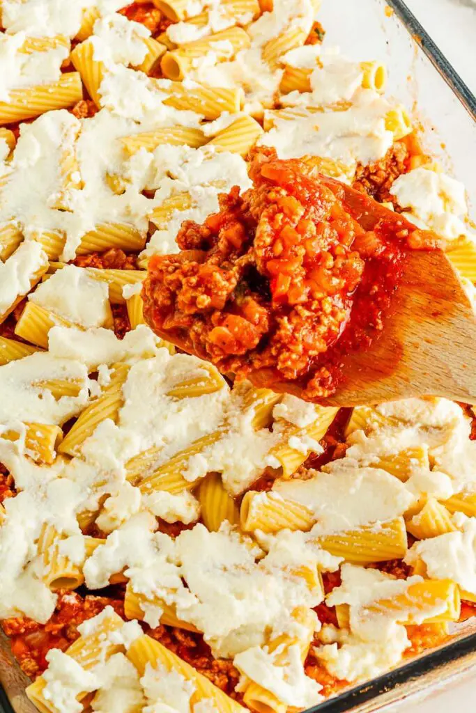 Spread more sauce and cheese