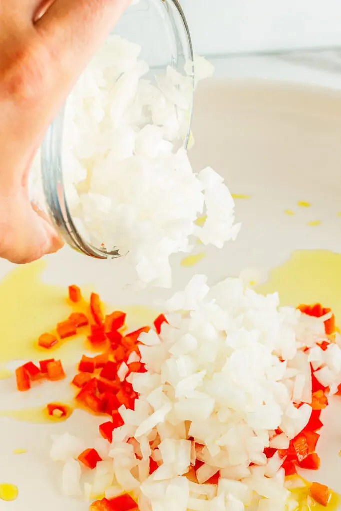 Add onions and red peppers