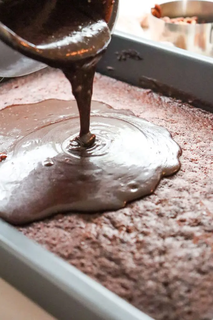 Pour liquid frosting over gluten free chocolate cake