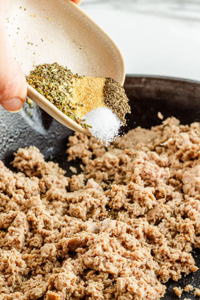 add spices to ground turkey skillet