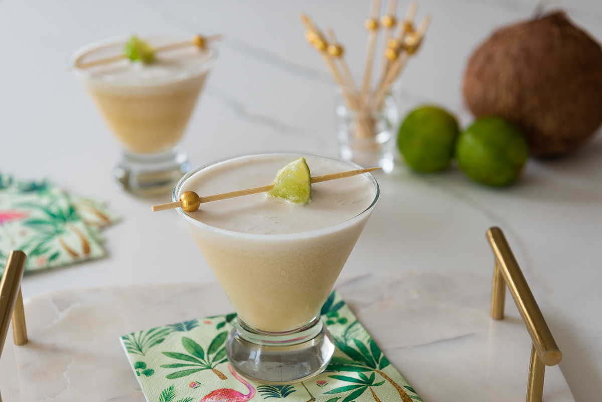 Easy Coconut Martini Mocktail with limes on a tropical napkin 