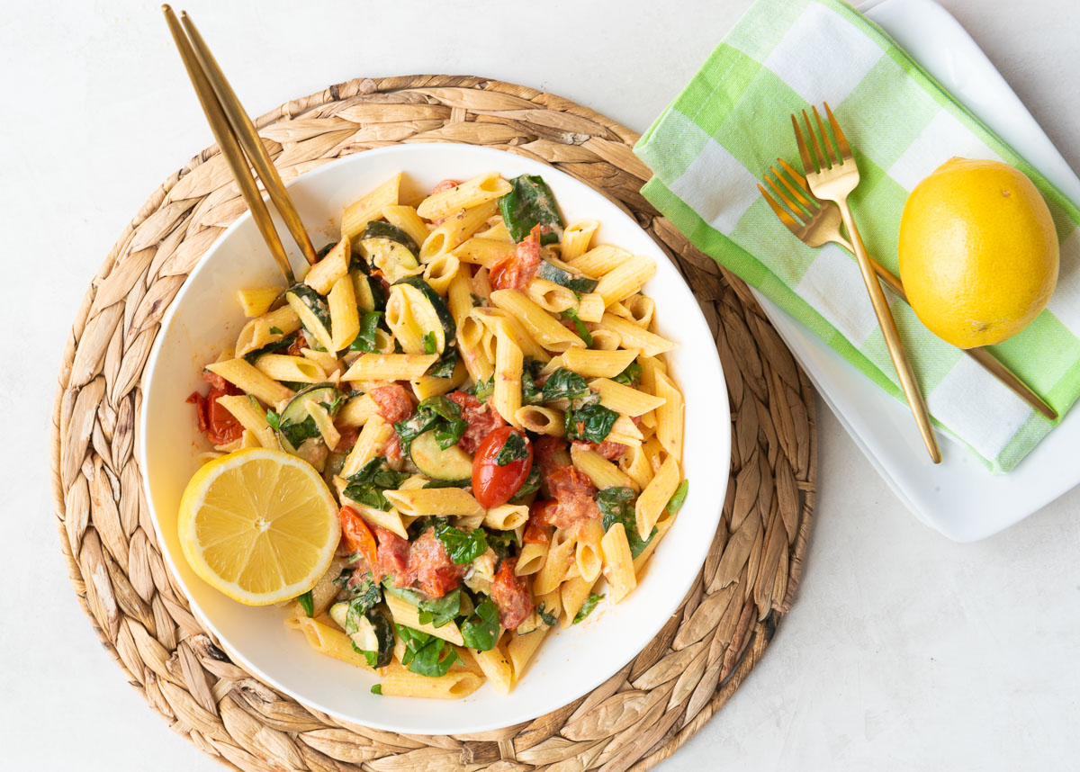 Large bowl of Pasta with Tomatoes, Spinach, Boursin Cheese