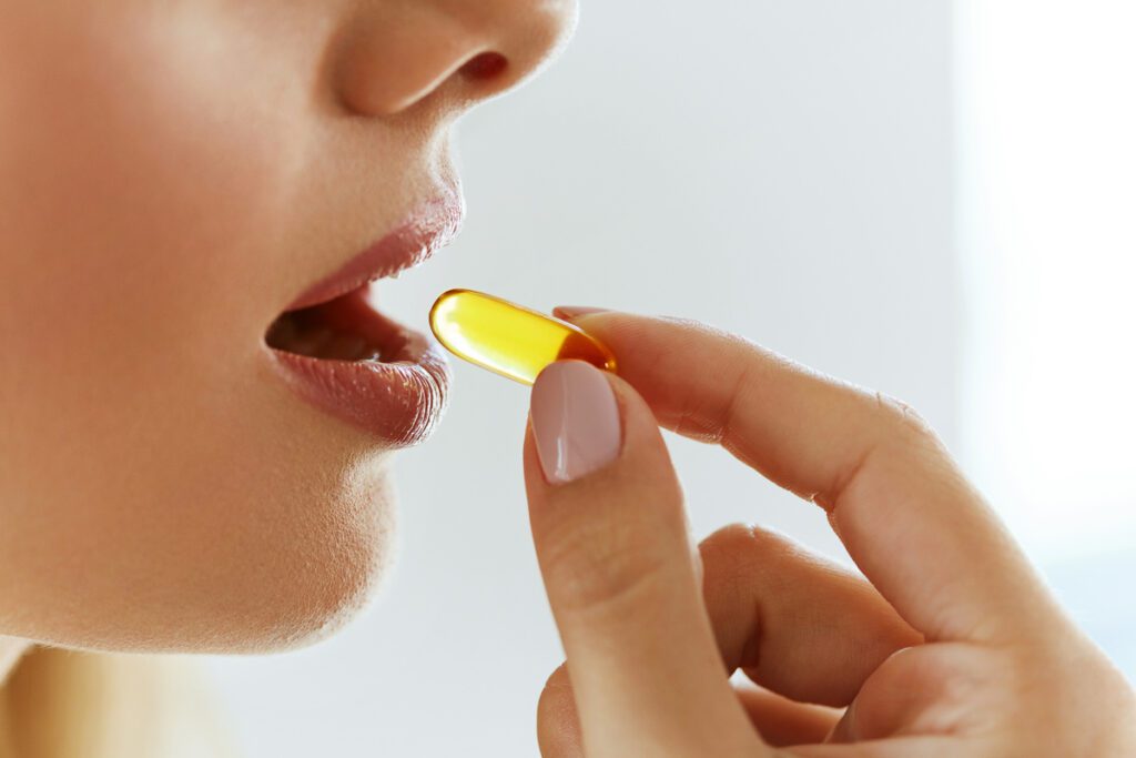 Woman taking a supplement 