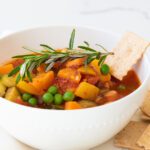 Fresh vegetable soup with herbs and butternut squash