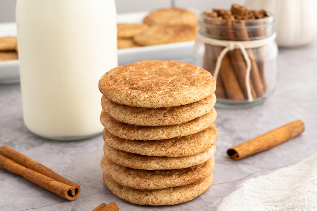 Stack of Gluten-Free Snickerdoodle Cookies with Milk and Cinnamon Sticks