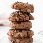 Tall stack of double chocolate chip cookies that are gluten-free