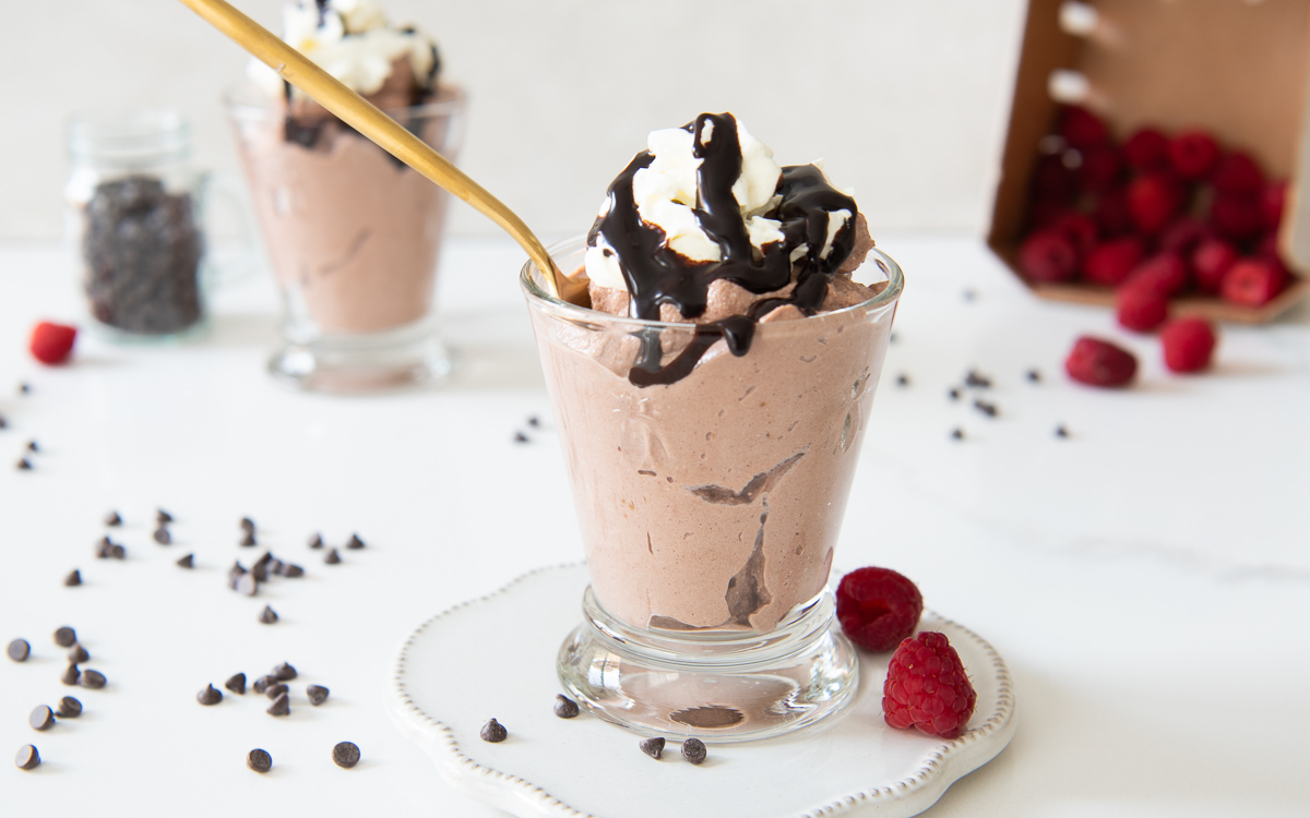 glasses of chocolate protein powder with chocolate syrup