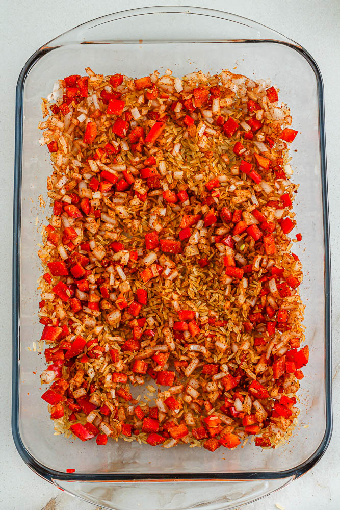 spread spices in layer with rice, bell pepper and cayenne